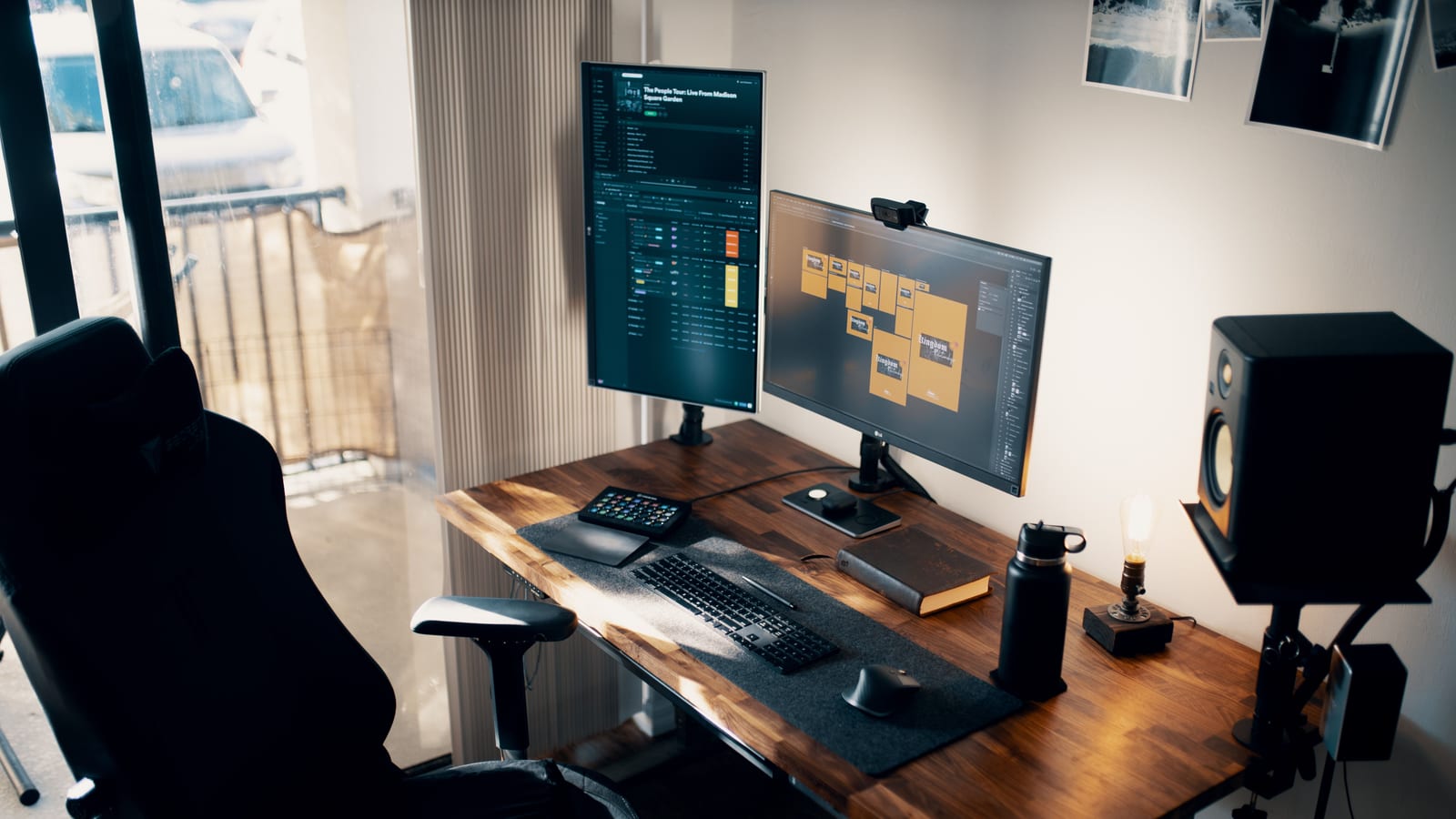 Contemporary office setup with dual monitors, ergonomic chair, and wooden desk.